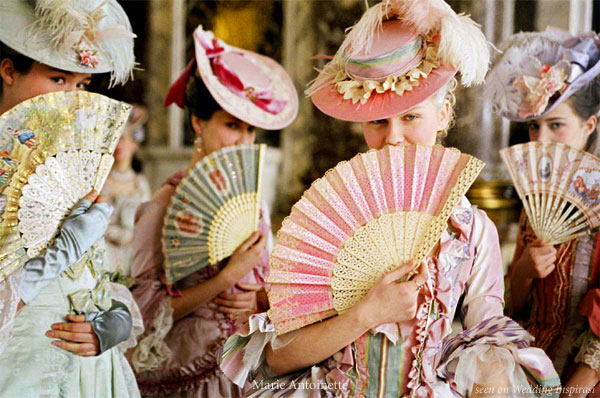 Kirsten Dunst as Marie Antoinette. Lace, paper and silk painted hand fans and over the top, feminine hats complement the beautiful costumes designed by Milena Canonero